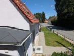 Zwei Häuser auf einem Grundstück – Wohnen, Vermieten oder beides kombinieren - Blick aus dem Fenster