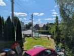 Zwei Häuser auf einem Grundstück – Wohnen, Vermieten oder beides kombinieren - Blick aus dem Fenster