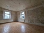 Renovierungswohnung mit dauerhaft günstiger Miete in Neugersdorf - Wohnzimmer