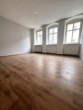 Denkmalgeschütztes Wohn- und Geschäftshaus im Herzen von Zittau – Solide Substanz mit Entwicklungspotenzial - Wohnzimmer II.jpg
